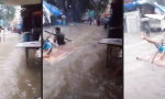 Lustiges Video : Gute Laune im Hochwasser von Mumbai